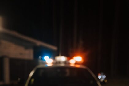 yellow crime tape against police car