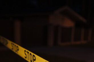 yellow police tape on crime scene